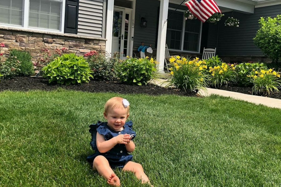 Philip Mazzotti's daughter in the front yard