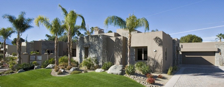 Palm trees in the front yard of a home 